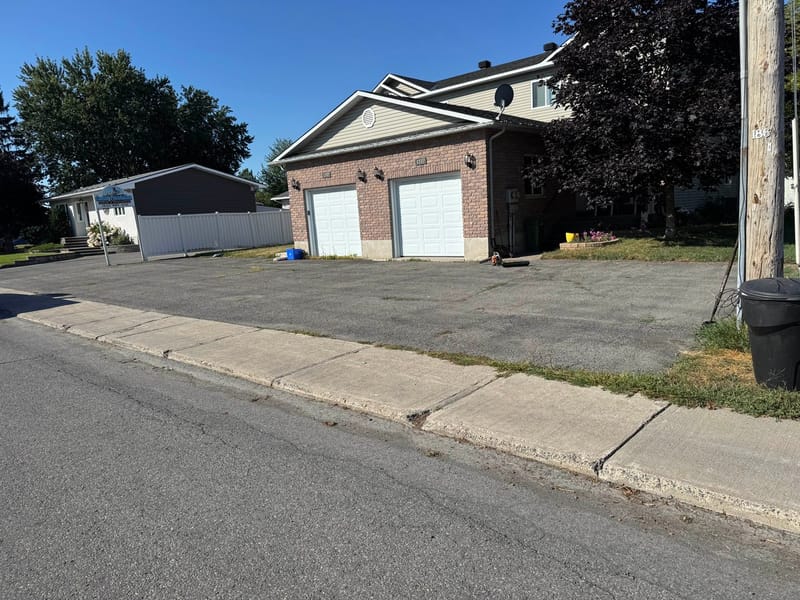 Faded, cracked driveway before sealing