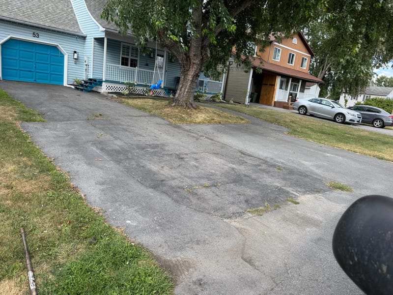 Worn driveway before sealing